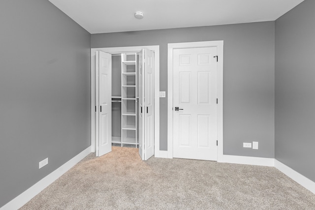 unfurnished bedroom featuring carpet flooring