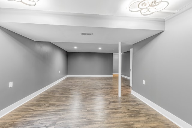 basement featuring wood-type flooring