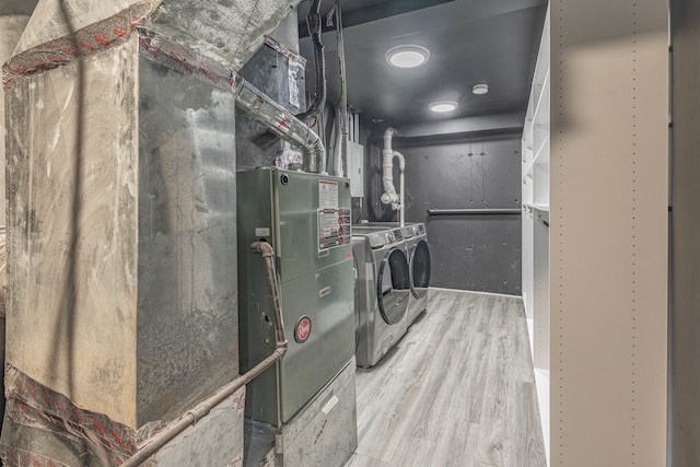 interior space with wood-type flooring and separate washer and dryer