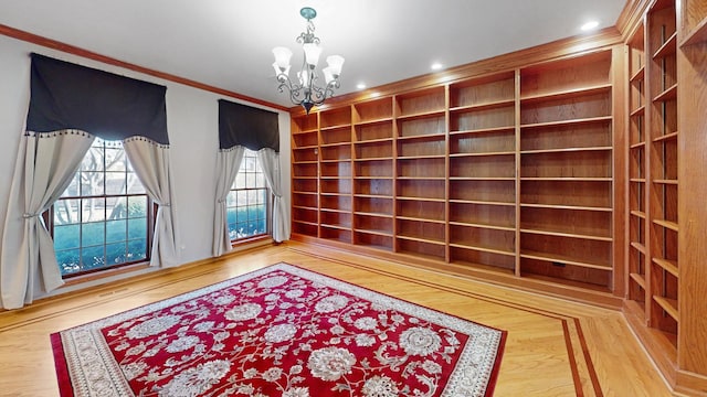 unfurnished room with parquet flooring, a notable chandelier, recessed lighting, and ornamental molding