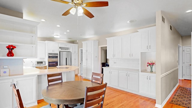 dining space featuring light wood finished floors, visible vents, recessed lighting, and a ceiling fan