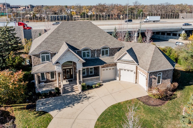 view of front of home featuring a porch and a garage