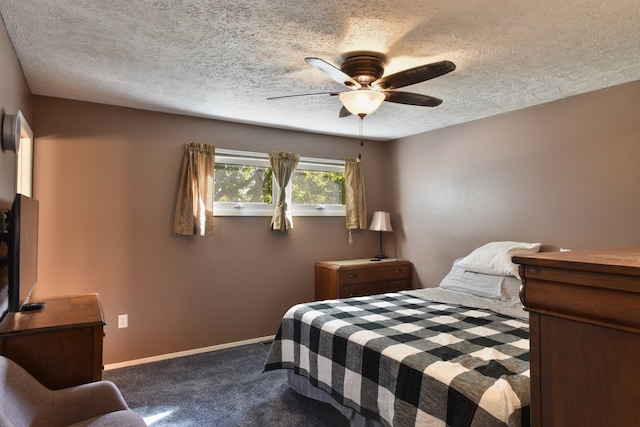 bedroom with a textured ceiling, carpet flooring, and ceiling fan