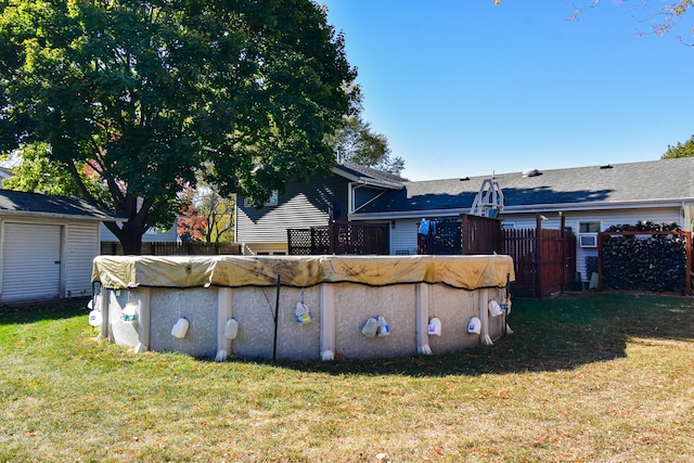 view of yard featuring a covered pool