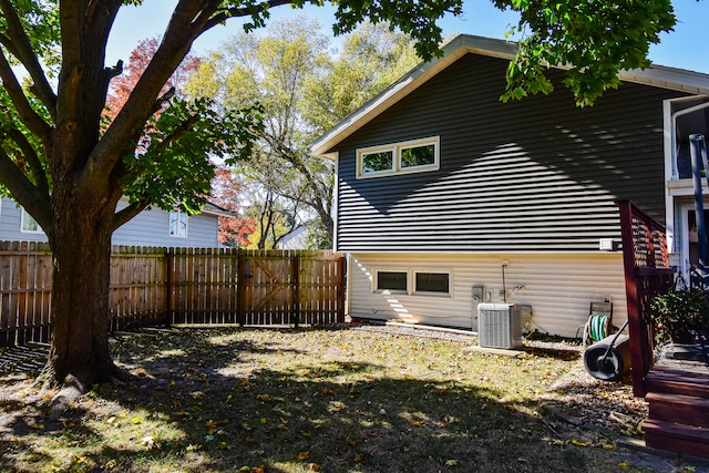 back of property featuring central AC