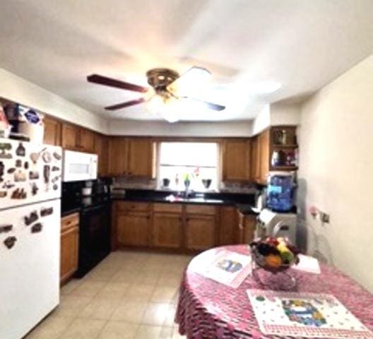 6634 W 95th St Unit 1D, Oak Lawn, IL 60453 - kitchen featuring white appliances, brown cabinets, a ceiling fan, and a sink