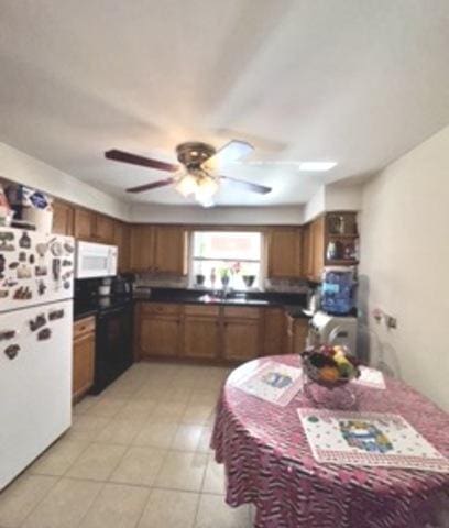 6634 W 95th St Unit 1D, Oak Lawn, IL 60453 - kitchen with white appliances, brown cabinets, ceiling fan, a sink, and dark countertops