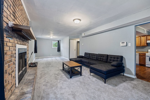 carpeted living room with a fireplace