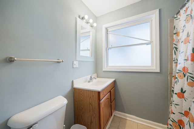 bathroom with a shower with shower curtain, vanity, baseboards, tile patterned floors, and toilet