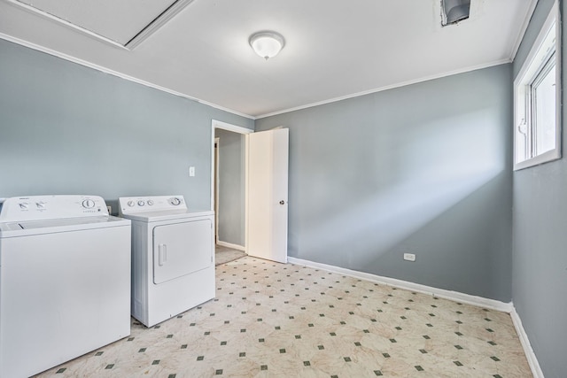 washroom with laundry area, washing machine and clothes dryer, ornamental molding, and light floors