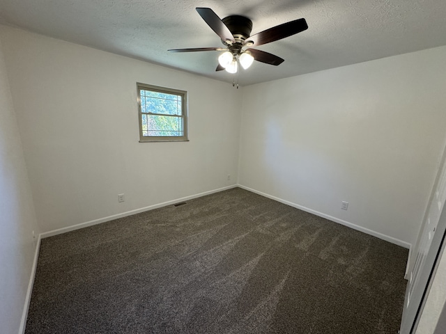 unfurnished room with dark carpet, a textured ceiling, and ceiling fan