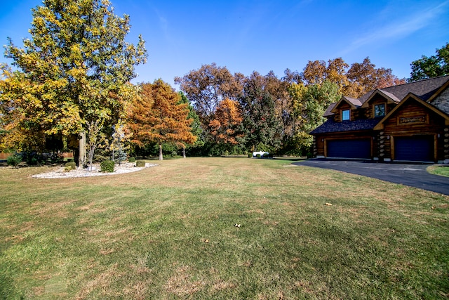 view of yard with a garage