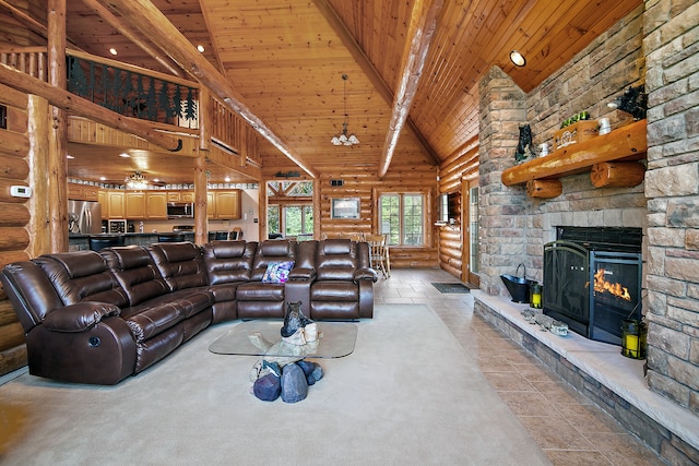 living room featuring beamed ceiling, a stone fireplace, wood ceiling, and high vaulted ceiling