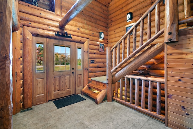 foyer entrance with rustic walls