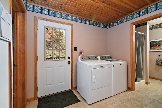 laundry area featuring washer and dryer and wooden ceiling