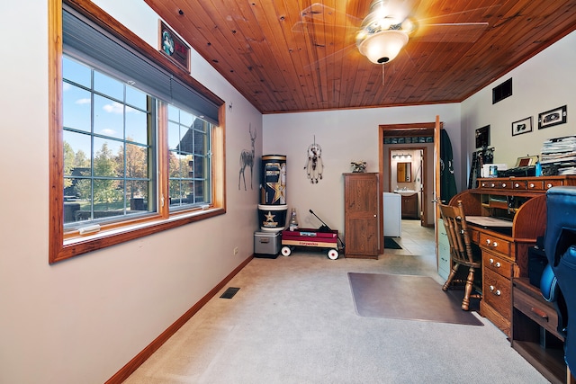 office with wood ceiling, light carpet, and a wealth of natural light