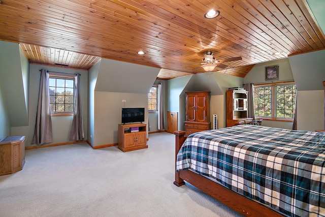 bedroom featuring wood ceiling, light colored carpet, lofted ceiling, and ceiling fan