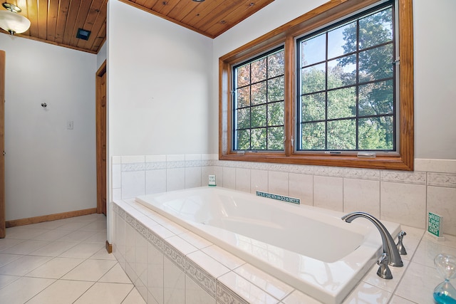 bathroom featuring wooden ceiling, vaulted ceiling, and tiled tub