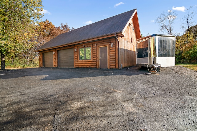 view of property exterior with a garage