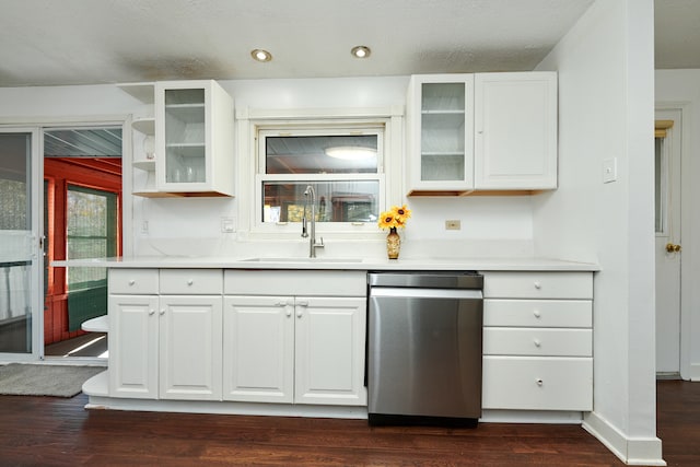 kitchen featuring white cabinetry, dishwasher, and sink