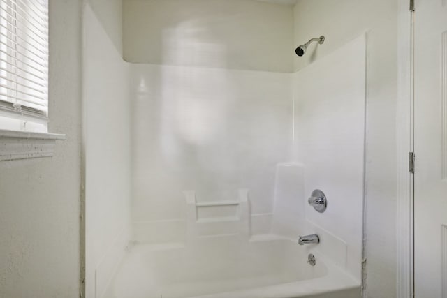 bathroom with bathing tub / shower combination