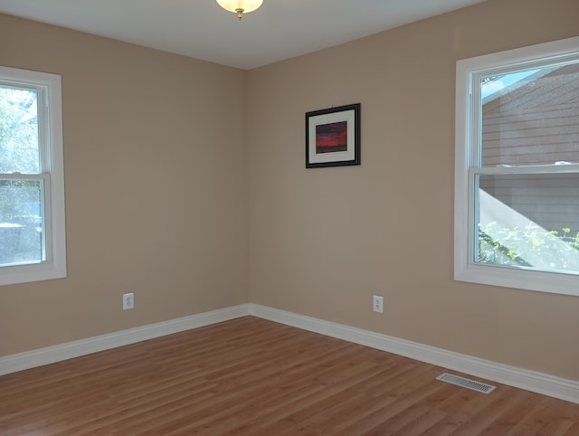 unfurnished room featuring wood-type flooring