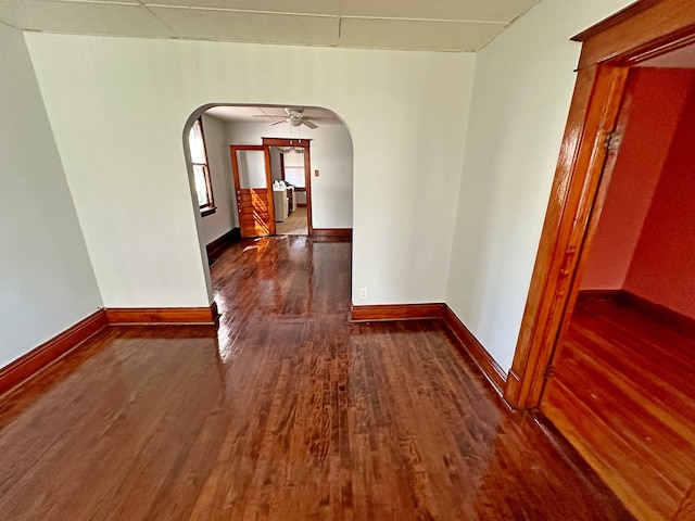 hallway with dark wood-type flooring