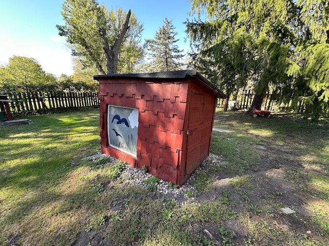 view of outdoor structure with a lawn