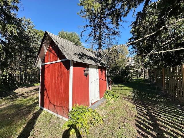 view of outdoor structure featuring a lawn