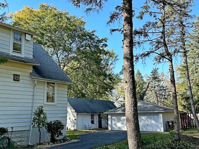 view of front of property with an outbuilding and a garage