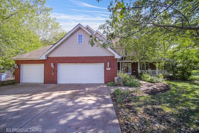 view of front of home with a porch and a garage