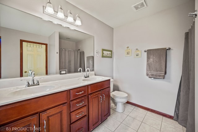 bathroom with walk in shower, vanity, toilet, and tile patterned flooring