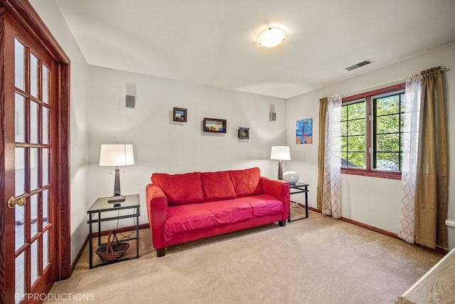 living room featuring light carpet