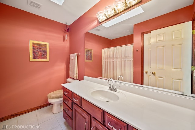 bathroom featuring vanity, toilet, and tile patterned floors