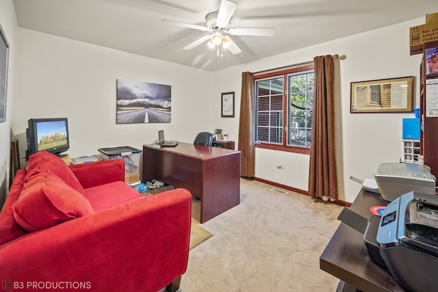 office area with a wall mounted air conditioner, light colored carpet, and ceiling fan