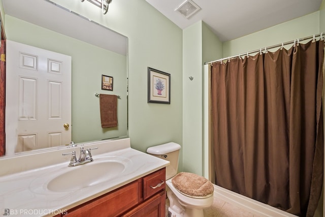 bathroom with vanity, toilet, tile patterned floors, and a shower with shower curtain