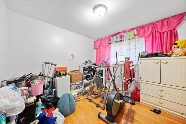 exercise area featuring wood finished floors