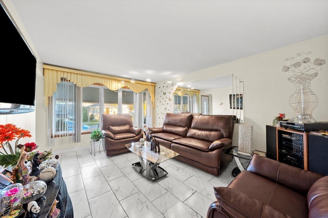 living area featuring marble finish floor