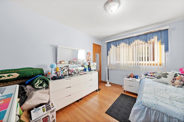 bedroom with light wood-type flooring