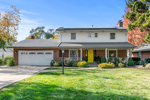 front of property featuring a front yard, a porch, and a garage