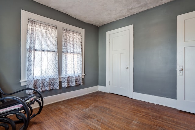 living area with dark hardwood / wood-style flooring