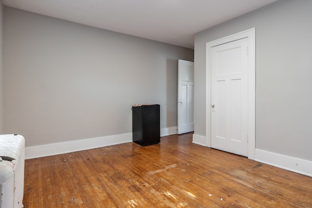 empty room with light hardwood / wood-style floors