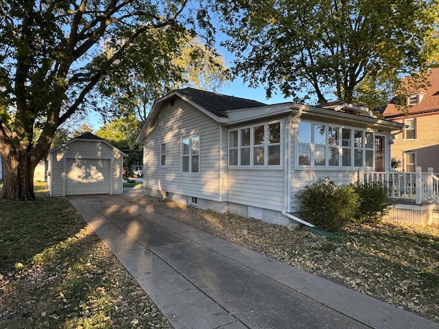 view of home's exterior with an outdoor structure and a garage