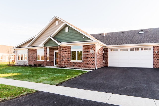 view of front of house with a front lawn and a garage