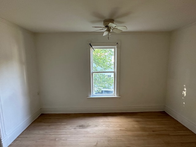 spare room with light hardwood / wood-style floors and ceiling fan