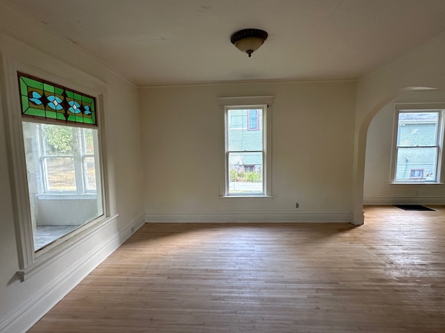 empty room with light hardwood / wood-style floors