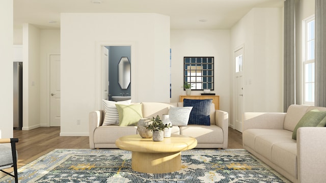 living room featuring a wealth of natural light and wood-type flooring