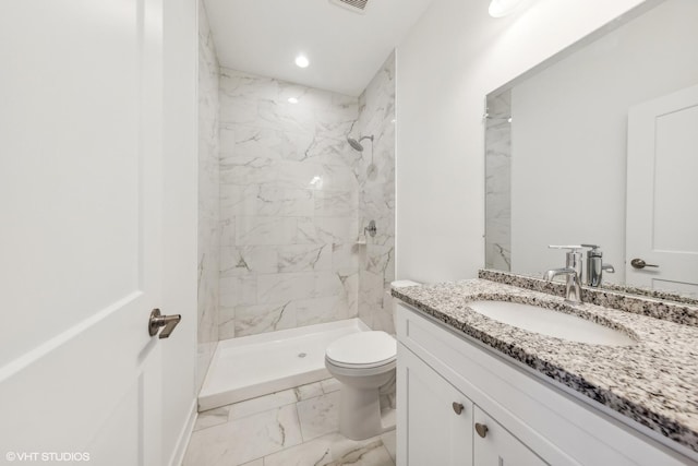 bathroom with a shower stall, marble finish floor, toilet, and vanity