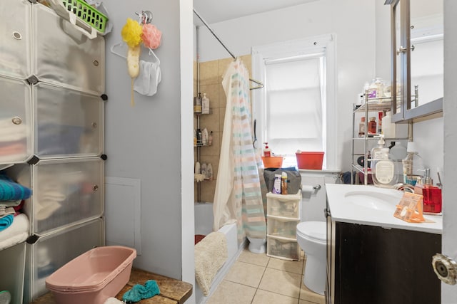 full bathroom featuring vanity, toilet, tile patterned floors, and shower / bath combo