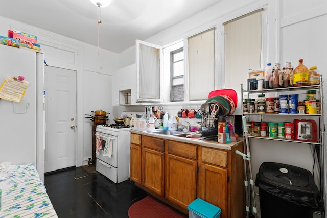 kitchen featuring sink and white appliances